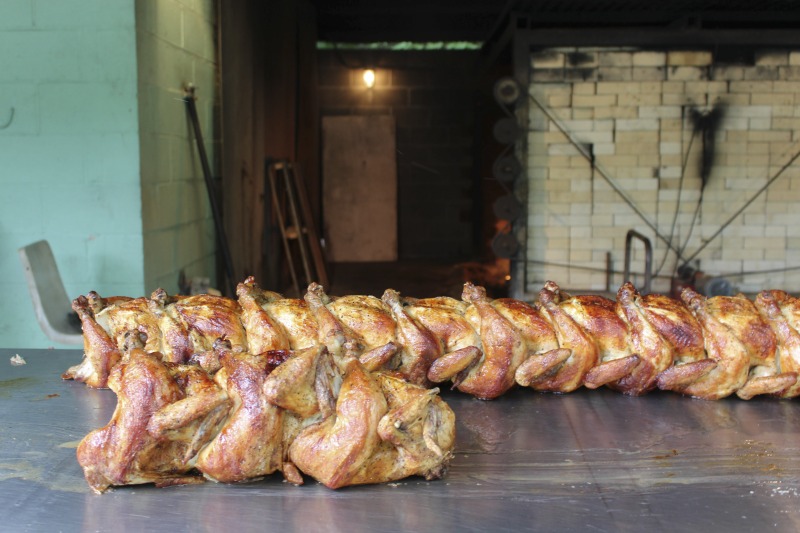 ["Every summer Wednesday since 1969, members of the Serbian Eastern Orthodox Church Mens Club have hosted a Chicken Blast at the Serbian Picnic Grounds along Kings Creek outside of Weirton, West Virginia. They roast 300-400 chickens per week as a fundraiser for the maintenance of the picnic grounds. The spits, an industrial brick oven, and walk-in coolers were constructed in the 1960s out of material from Weirton Steel by Mens Club members, most of whom were Weirton Steel employees. Each week, the choir also sells pogacha (a type of Serbian bread), haluski or cabbage and noodles, corn on the cob, strudel and other desserts. The bar at the picnic grounds is also open, serving beer and Slivovitz.See the short video and audio documentary about the Chicken Blasts, produced by the West Virginia Folklife Program and West Virginia Public Broadcasting: https://wvfolklife.org/2020/01/27/weirtons-serbian-heritage-is-a-chicken-blast/ https://www.youtube.com/watch?v=XpGF-MFUlhYhttps://soundcloud.com/wvpublicnews/weirtons-serbian-heritage-is-a-chicken-blast"]%