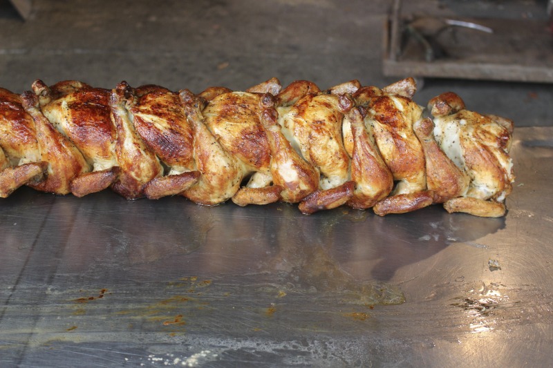 ["Every summer Wednesday since 1969, members of the Serbian Eastern Orthodox Church Mens Club have hosted a Chicken Blast at the Serbian Picnic Grounds along Kings Creek outside of Weirton, West Virginia. They roast 300-400 chickens per week as a fundraiser for the maintenance of the picnic grounds. The spits, an industrial brick oven, and walk-in coolers were constructed in the 1960s out of material from Weirton Steel by Mens Club members, most of whom were Weirton Steel employees. Each week, the choir also sells pogacha (a type of Serbian bread), haluski or cabbage and noodles, corn on the cob, strudel and other desserts. The bar at the picnic grounds is also open, serving beer and Slivovitz.See the short video and audio documentary about the Chicken Blasts, produced by the West Virginia Folklife Program and West Virginia Public Broadcasting: https://wvfolklife.org/2020/01/27/weirtons-serbian-heritage-is-a-chicken-blast/ https://www.youtube.com/watch?v=XpGF-MFUlhYhttps://soundcloud.com/wvpublicnews/weirtons-serbian-heritage-is-a-chicken-blast"]%