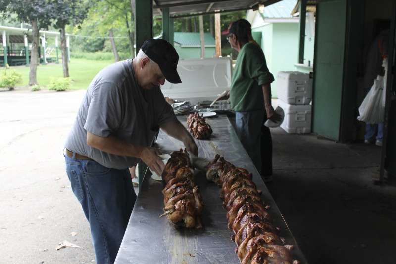 ["Every summer Wednesday since 1969, members of the Serbian Eastern Orthodox Church Mens Club have hosted a Chicken Blast at the Serbian Picnic Grounds along Kings Creek outside of Weirton, West Virginia. They roast 300-400 chickens per week as a fundraiser for the maintenance of the picnic grounds. The spits, an industrial brick oven, and walk-in coolers were constructed in the 1960s out of material from Weirton Steel by Mens Club members, most of whom were Weirton Steel employees. Each week, the choir also sells pogacha (a type of Serbian bread), haluski or cabbage and noodles, corn on the cob, strudel and other desserts. The bar at the picnic grounds is also open, serving beer and Slivovitz.See the short video and audio documentary about the Chicken Blasts, produced by the West Virginia Folklife Program and West Virginia Public Broadcasting: https://wvfolklife.org/2020/01/27/weirtons-serbian-heritage-is-a-chicken-blast/ https://www.youtube.com/watch?v=XpGF-MFUlhYhttps://soundcloud.com/wvpublicnews/weirtons-serbian-heritage-is-a-chicken-blast"]%