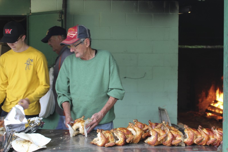 Every summer Wednesday since 1969, members of the Serbian Eastern Orthodox Church Mens Club have hosted a Chicken Blast at the Serbian Picnic Grounds along Kings Creek outside of Weirton, West Virginia. They roast 300-400 chickens per week as a fundraiser for the maintenance of the picnic grounds. The spits, an industrial brick oven, and walk-in coolers were constructed in the 1960s out of material from Weirton Steel by Mens Club members, most of whom were Weirton Steel employees. Each week, the choir also sells pogacha (a type of Serbian bread), haluski or cabbage and noodles, corn on the cob, strudel and other desserts. The bar at the picnic grounds is also open, serving beer and Slivovitz.See the short video and audio documentary about the Chicken Blasts, produced by the West Virginia Folklife Program and West Virginia Public Broadcasting: https://wvfolklife.org/2020/01/27/weirtons-serbian-heritage-is-a-chicken-blast/ https://www.youtube.com/watch?v=XpGF-MFUlhYhttps://soundcloud.com/wvpublicnews/weirtons-serbian-heritage-is-a-chicken-blast