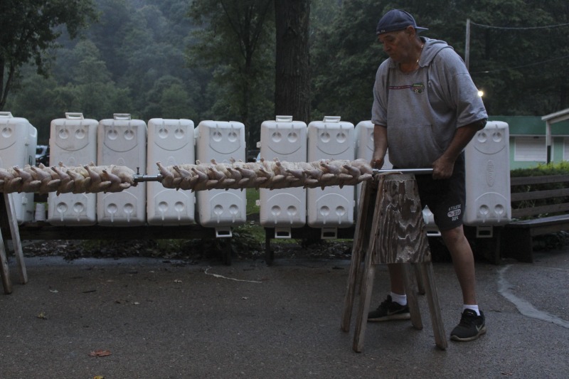 ["Every summer Wednesday since 1969, members of the Serbian Eastern Orthodox Church Mens Club have hosted a Chicken Blast at the Serbian Picnic Grounds along Kings Creek outside of Weirton, West Virginia. They roast 300-400 chickens per week as a fundraiser for the maintenance of the picnic grounds. The spits, an industrial brick oven, and walk-in coolers were constructed in the 1960s out of material from Weirton Steel by Mens Club members, most of whom were Weirton Steel employees. Each week, the choir also sells pogacha (a type of Serbian bread), haluski or cabbage and noodles, corn on the cob, strudel and other desserts. The bar at the picnic grounds is also open, serving beer and Slivovitz.See the short video and audio documentary about the Chicken Blasts, produced by the West Virginia Folklife Program and West Virginia Public Broadcasting: https://wvfolklife.org/2020/01/27/weirtons-serbian-heritage-is-a-chicken-blast/ https://www.youtube.com/watch?v=XpGF-MFUlhYhttps://soundcloud.com/wvpublicnews/weirtons-serbian-heritage-is-a-chicken-blast"]%