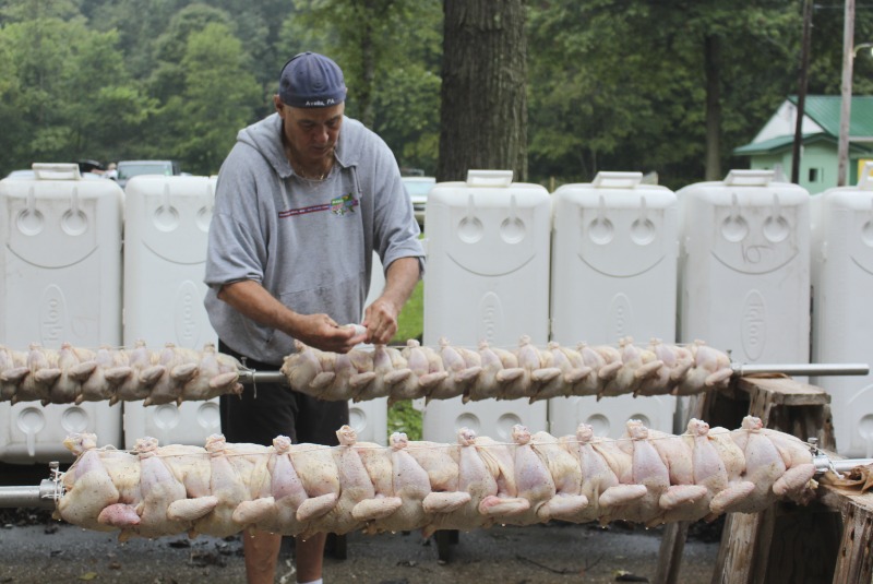 ["Every summer Wednesday since 1969, members of the Serbian Eastern Orthodox Church Mens Club have hosted a Chicken Blast at the Serbian Picnic Grounds along Kings Creek outside of Weirton, West Virginia. They roast 300-400 chickens per week as a fundraiser for the maintenance of the picnic grounds. The spits, an industrial brick oven, and walk-in coolers were constructed in the 1960s out of material from Weirton Steel by Mens Club members, most of whom were Weirton Steel employees. Each week, the choir also sells pogacha (a type of Serbian bread), haluski or cabbage and noodles, corn on the cob, strudel and other desserts. The bar at the picnic grounds is also open, serving beer and Slivovitz.See the short video and audio documentary about the Chicken Blasts, produced by the West Virginia Folklife Program and West Virginia Public Broadcasting: https://wvfolklife.org/2020/01/27/weirtons-serbian-heritage-is-a-chicken-blast/ https://www.youtube.com/watch?v=XpGF-MFUlhYhttps://soundcloud.com/wvpublicnews/weirtons-serbian-heritage-is-a-chicken-blast"]%