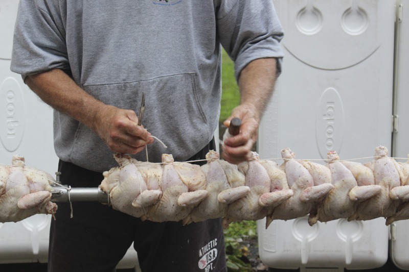 ["Every summer Wednesday since 1969, members of the Serbian Eastern Orthodox Church Mens Club have hosted a Chicken Blast at the Serbian Picnic Grounds along Kings Creek outside of Weirton, West Virginia. They roast 300-400 chickens per week as a fundraiser for the maintenance of the picnic grounds. The spits, an industrial brick oven, and walk-in coolers were constructed in the 1960s out of material from Weirton Steel by Mens Club members, most of whom were Weirton Steel employees. Each week, the choir also sells pogacha (a type of Serbian bread), haluski or cabbage and noodles, corn on the cob, strudel and other desserts. The bar at the picnic grounds is also open, serving beer and Slivovitz.See the short video and audio documentary about the Chicken Blasts, produced by the West Virginia Folklife Program and West Virginia Public Broadcasting: https://wvfolklife.org/2020/01/27/weirtons-serbian-heritage-is-a-chicken-blast/ https://www.youtube.com/watch?v=XpGF-MFUlhYhttps://soundcloud.com/wvpublicnews/weirtons-serbian-heritage-is-a-chicken-blast"]%