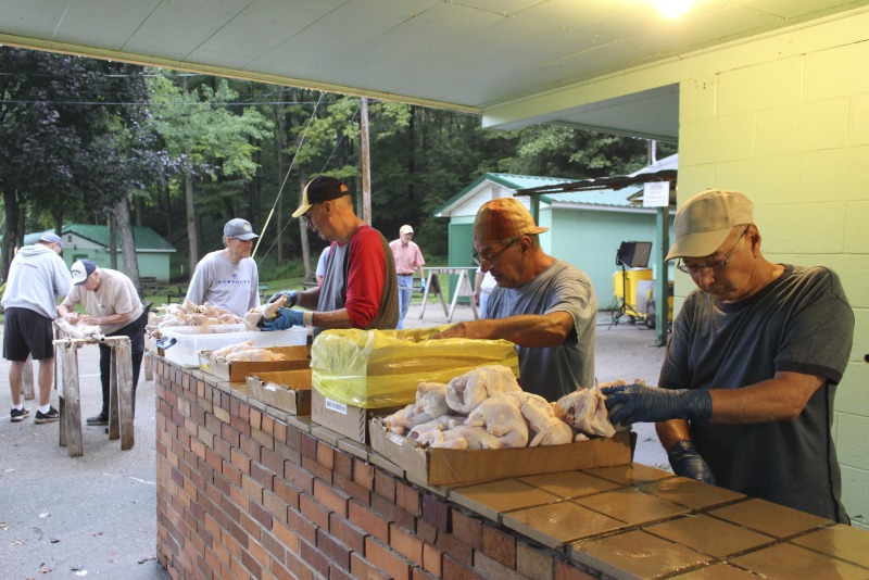 ["Every summer Wednesday since 1969, members of the Serbian Eastern Orthodox Church Mens Club have hosted a Chicken Blast at the Serbian Picnic Grounds along Kings Creek outside of Weirton, West Virginia. They roast 300-400 chickens per week as a fundraiser for the maintenance of the picnic grounds. The spits, an industrial brick oven, and walk-in coolers were constructed in the 1960s out of material from Weirton Steel by Mens Club members, most of whom were Weirton Steel employees. Each week, the choir also sells pogacha (a type of Serbian bread), haluski or cabbage and noodles, corn on the cob, strudel and other desserts. The bar at the picnic grounds is also open, serving beer and Slivovitz.See the short video and audio documentary about the Chicken Blasts, produced by the West Virginia Folklife Program and West Virginia Public Broadcasting: https://wvfolklife.org/2020/01/27/weirtons-serbian-heritage-is-a-chicken-blast/ https://www.youtube.com/watch?v=XpGF-MFUlhYhttps://soundcloud.com/wvpublicnews/weirtons-serbian-heritage-is-a-chicken-blast"]%