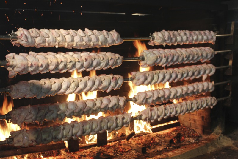 ["Every summer Wednesday since 1969, members of the Serbian Eastern Orthodox Church Mens Club have hosted a Chicken Blast at the Serbian Picnic Grounds along Kings Creek outside of Weirton, West Virginia. They roast 300-400 chickens per week as a fundraiser for the maintenance of the picnic grounds. The spits, an industrial brick oven, and walk-in coolers were constructed in the 1960s out of material from Weirton Steel by Mens Club members, most of whom were Weirton Steel employees. Each week, the choir also sells pogacha (a type of Serbian bread), haluski or cabbage and noodles, corn on the cob, strudel and other desserts. The bar at the picnic grounds is also open, serving beer and Slivovitz.See the short video and audio documentary about the Chicken Blasts, produced by the West Virginia Folklife Program and West Virginia Public Broadcasting: https://wvfolklife.org/2020/01/27/weirtons-serbian-heritage-is-a-chicken-blast/ https://www.youtube.com/watch?v=XpGF-MFUlhYhttps://soundcloud.com/wvpublicnews/weirtons-serbian-heritage-is-a-chicken-blast"]%