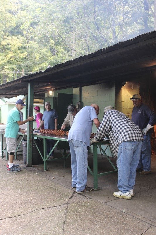 ["Every summer Wednesday since 1969, members of the Serbian Eastern Orthodox Church Mens Club have hosted a Chicken Blast at the Serbian Picnic Grounds along Kings Creek outside of Weirton, West Virginia. They roast 300-400 chickens per week as a fundraiser for the maintenance of the picnic grounds. The spits, an industrial brick oven, and walk-in coolers were constructed in the 1960s out of material from Weirton Steel by Mens Club members, most of whom were Weirton Steel employees. Each week, the choir also sells pogacha (a type of Serbian bread), haluski or cabbage and noodles, corn on the cob, strudel and other desserts. The bar at the picnic grounds is also open, serving beer and Slivovitz.See the short video and audio documentary about the Chicken Blasts, produced by the West Virginia Folklife Program and West Virginia Public Broadcasting: https://wvfolklife.org/2020/01/27/weirtons-serbian-heritage-is-a-chicken-blast/ https://www.youtube.com/watch?v=XpGF-MFUlhYhttps://soundcloud.com/wvpublicnews/weirtons-serbian-heritage-is-a-chicken-blast"]%