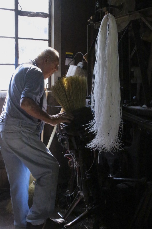 ["James Shaffer, b. 1929, of Charleston Broom and Mop, in Loudendale, WV is one of the last commercial broom makers in the state of West Virginia. He began making brooms at the age of 17 and at the time of the interview, still maintained a shop outside of Charleston. See the short video produced in partnership with West Virginia Public Broadcasting:, James Shaffer, Charleston Broom & Mop Company at https://www.youtube.com/watch?time_continue=1&v=O3lrgTn2hyM and the interview with Jim, Building a Broom by Feel: Jim Shaffer by Emily Hilliard in Southern Cultures fall 2017, Vol. 23, No. 3: Things at http://www.southerncultures.org/article/building-broom-feel-jim-shaffer/"]%