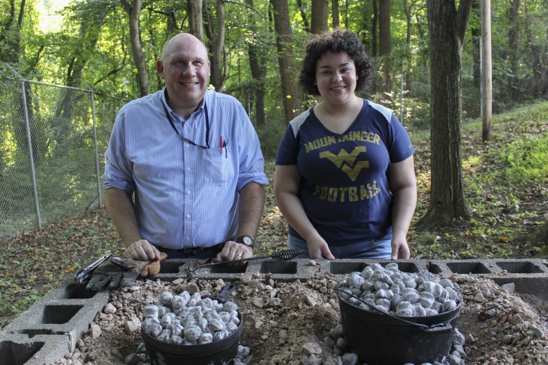 ["On September 21, 2017, old-time musician and writer Pete Koskys Appalachian Studies class at South Charleston High School made biscuits in a cast iron Dutch oven over a charcoal fire at the ROTC picnic shelter on the school campus. Kosky invited state folklorist Emily Hilliard to the class."]%