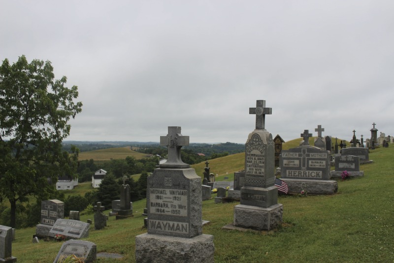 ["St. Joseph Settlement aka the German Settlement is a rural community of farms on the Marshall-Wetzel County borders, settled by German Catholic immigrants in the 1850s. As Cheryl Harshman says in her e-WV article on the settlement, the church, schoolhouse (now a public library and parish museum), rectory, community building, and cemetery are still the heart of the St. Joseph community.On June 22, 2016, Harshman hosted state folklorist Emily Hilliard on a visit to the settlement, meeting community members Jim and Debbie Frohnapfel and Ray Esteep and visiting the church and cemetery.Learn more via e-WV: https://www.wvencyclopedia.org/articles/158"]%