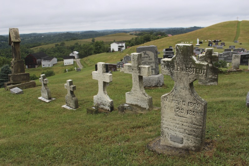 ["St. Joseph Settlement aka the German Settlement is a rural community of farms on the Marshall-Wetzel County borders, settled by German Catholic immigrants in the 1850s. As Cheryl Harshman says in her e-WV article on the settlement, the church, schoolhouse (now a public library and parish museum), rectory, community building, and cemetery are still the heart of the St. Joseph community.On June 22, 2016, Harshman hosted state folklorist Emily Hilliard on a visit to the settlement, meeting community members Jim and Debbie Frohnapfel and Ray Esteep and visiting the church and cemetery.Learn more via e-WV: https://www.wvencyclopedia.org/articles/158"]%