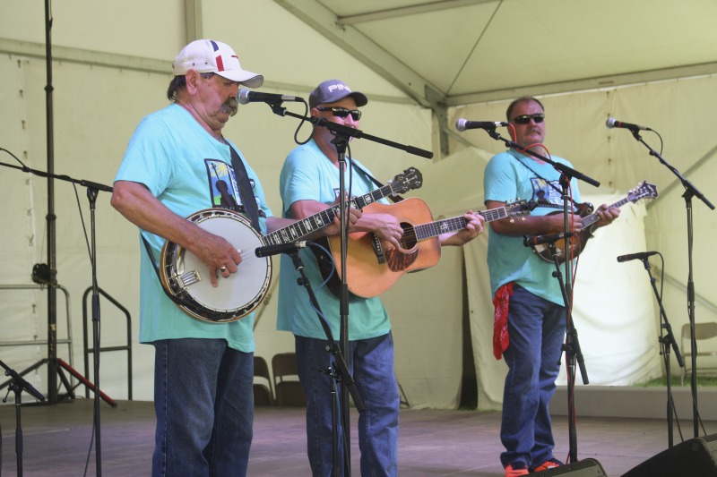 ["From the Mountain Music Trail: \"The Black Mountain Bluegrass Boys are among West Virginias longest-running bluegrass bands. The group first organized in 1968 around the foursome of Richard Hefner (banjo/tenor vocal), his brother Bill Hefner (guitar/mandolin/baritone vocal), their late uncle Glenn Dude Irvine (mandolin) and the late Harley Carpenter (guitar/lead vocal). They took their name from Black Mountain in their native Pocahontas County. For five years the group worked a weekly radio show on WVAR, in Richwood. They also made regular appearances at local events and regional bluegrass festivals. They recorded their first album in January 1971, Pure Old Bluegrass, and in the mid-1970s they followed up with a pair of albums: Million Lonely Days and Talk of the County. More recent albums include Black Mountain Bluegrass Boys 1968-1973, Live at Midnight, Live at The Opera House, and Live at Greenbrier Valley Theatre.As with many bluegrass bands, the Black Mountain Bluegrass Boys have had changes in personnel over the years. Richard Hefner remains as the lone original member. Hefners traditional bluegrass banjo playing and tenor vocals have contributed both continuity and much of the high lonesome sound for which the band has become so well-known. He has displayed his banjo skills many times as a victor in contests and at the Vandalia Festival. Chris Nickell from Monroe County, contributes driving lead and rhythm guitar work as well as lead vocals. Rick Carpenterson of founding member Harley Carpenterpicks a fine mandolin and sings lead and baritone vocals. Bass player Mike Smith, of Culloden, has worked with such notables as Larry Sparks, Dave Evans, and the Goins Brothers.\"Read more: https://mountainmusictrail.com/the-black-mountain-bluegrass-boys/"]%