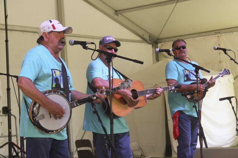 ["From the Mountain Music Trail: \"The Black Mountain Bluegrass Boys are among West Virginias longest-running bluegrass bands. The group first organized in 1968 around the foursome of Richard Hefner (banjo/tenor vocal), his brother Bill Hefner (guitar/mandolin/baritone vocal), their late uncle Glenn Dude Irvine (mandolin) and the late Harley Carpenter (guitar/lead vocal). They took their name from Black Mountain in their native Pocahontas County. For five years the group worked a weekly radio show on WVAR, in Richwood. They also made regular appearances at local events and regional bluegrass festivals. They recorded their first album in January 1971, Pure Old Bluegrass, and in the mid-1970s they followed up with a pair of albums: Million Lonely Days and Talk of the County. More recent albums include Black Mountain Bluegrass Boys 1968-1973, Live at Midnight, Live at The Opera House, and Live at Greenbrier Valley Theatre.As with many bluegrass bands, the Black Mountain Bluegrass Boys have had changes in personnel over the years. Richard Hefner remains as the lone original member. Hefners traditional bluegrass banjo playing and tenor vocals have contributed both continuity and much of the high lonesome sound for which the band has become so well-known. He has displayed his banjo skills many times as a victor in contests and at the Vandalia Festival. Chris Nickell from Monroe County, contributes driving lead and rhythm guitar work as well as lead vocals. Rick Carpenterson of founding member Harley Carpenterpicks a fine mandolin and sings lead and baritone vocals. Bass player Mike Smith, of Culloden, has worked with such notables as Larry Sparks, Dave Evans, and the Goins Brothers.\"Read more: https://mountainmusictrail.com/the-black-mountain-bluegrass-boys/"]%