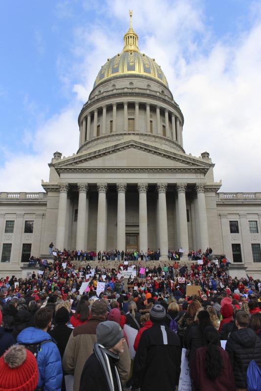 On February 22, 2018, thousands of West Virginia public school teachers and school service employees walked out of their classrooms in what would become a nine-day statewide strike. Teachers demands included a 5% raise and affordable healthcare coverage through the West Virginia Public Employees Insurance Agency or PEIA. These photos are part of a series of photos, videos, and interviews documenting the labor lore and expressive culture of the 2018 and 2019 West Virginia Teachers Strike.For more information on the 2018 and 2019 West Virginia Teachers Strike visit e-WV: https://www.wvencyclopedia.org/articles/2454