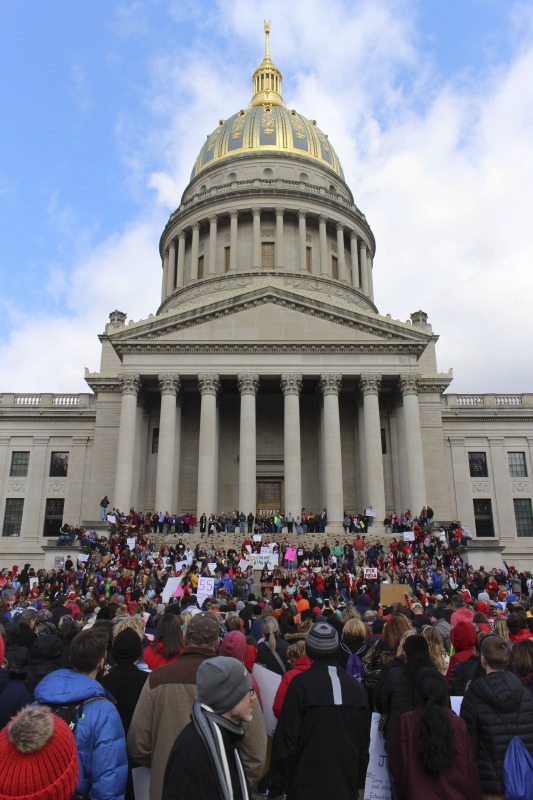 ["On February 22, 2018, thousands of West Virginia public school teachers and school service employees walked out of their classrooms in what would become a nine-day statewide strike. Teachers demands included a 5% raise and affordable healthcare coverage through the West Virginia Public Employees Insurance Agency or PEIA. These photos are part of a series of photos, videos, and interviews documenting the labor lore and expressive culture of the 2018 and 2019 West Virginia Teachers Strike.For more information on the 2018 and 2019 West Virginia Teachers Strike visit e-WV: https://www.wvencyclopedia.org/articles/2454"]%