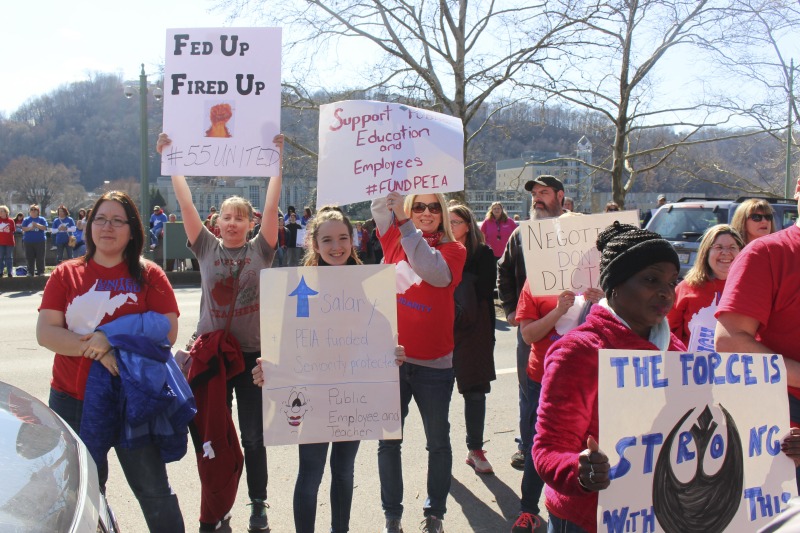 ["On February 22, 2018, thousands of West Virginia public school teachers and school service employees walked out of their classrooms in what would become a nine-day statewide strike. Teachers demands included a 5% raise and affordable healthcare coverage through the West Virginia Public Employees Insurance Agency or PEIA. These photos are part of a series of photos, videos, and interviews documenting the labor lore and expressive culture of the 2018 and 2019 West Virginia Teachers Strike.For more information on the 2018 and 2019 West Virginia Teachers Strike visit e-WV: https://www.wvencyclopedia.org/articles/2454"]%