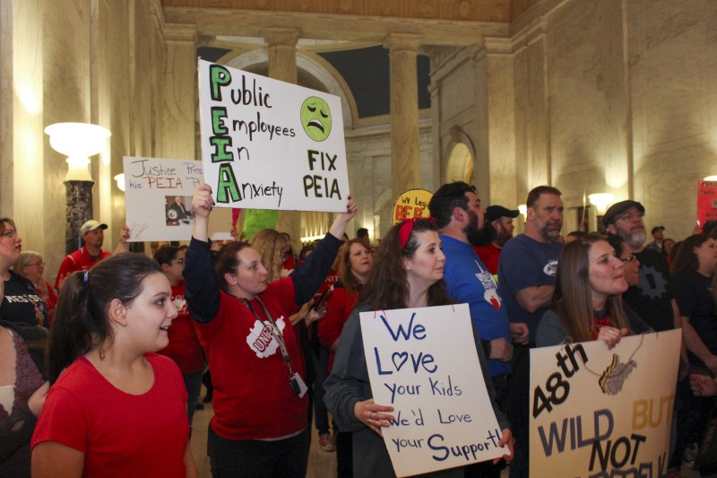 ["On February 22, 2018, thousands of West Virginia public school teachers and school service employees walked out of their classrooms in what would become a nine-day statewide strike. Teachers demands included a 5% raise and affordable healthcare coverage through the West Virginia Public Employees Insurance Agency or PEIA. These photos are part of a series of photos, videos, and interviews documenting the labor lore and expressive culture of the 2018 and 2019 West Virginia Teachers Strike.For more information on the 2018 and 2019 West Virginia Teachers Strike visit e-WV: https://www.wvencyclopedia.org/articles/2454"]%