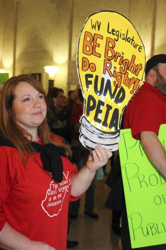 ["On February 22, 2018, thousands of West Virginia public school teachers and school service employees walked out of their classrooms in what would become a nine-day statewide strike. Teachers demands included a 5% raise and affordable healthcare coverage through the West Virginia Public Employees Insurance Agency or PEIA. These photos are part of a series of photos, videos, and interviews documenting the labor lore and expressive culture of the 2018 and 2019 West Virginia Teachers Strike.For more information on the 2018 and 2019 West Virginia Teachers Strike visit e-WV: https://www.wvencyclopedia.org/articles/2454"]%