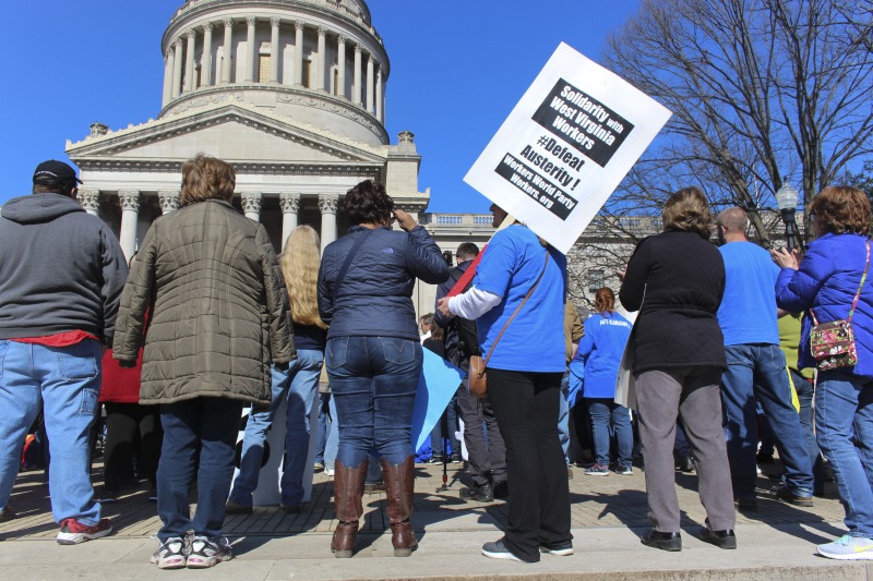 On February 22, 2018, thousands of West Virginia public school teachers and school service employees walked out of their classrooms in what would become a nine-day statewide strike. Teachers demands included a 5% raise and affordable healthcare coverage through the West Virginia Public Employees Insurance Agency or PEIA. These photos are part of a series of photos, videos, and interviews documenting the labor lore and expressive culture of the 2018 and 2019 West Virginia Teachers Strike.For more information on the 2018 and 2019 West Virginia Teachers Strike visit e-WV: https://www.wvencyclopedia.org/articles/2454