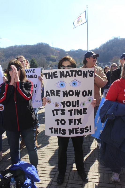 ["On February 22, 2018, thousands of West Virginia public school teachers and school service employees walked out of their classrooms in what would become a nine-day statewide strike. Teachers demands included a 5% raise and affordable healthcare coverage through the West Virginia Public Employees Insurance Agency or PEIA. These photos are part of a series of photos, videos, and interviews documenting the labor lore and expressive culture of the 2018 and 2019 West Virginia Teachers Strike.For more information on the 2018 and 2019 West Virginia Teachers Strike visit e-WV: https://www.wvencyclopedia.org/articles/2454"]%