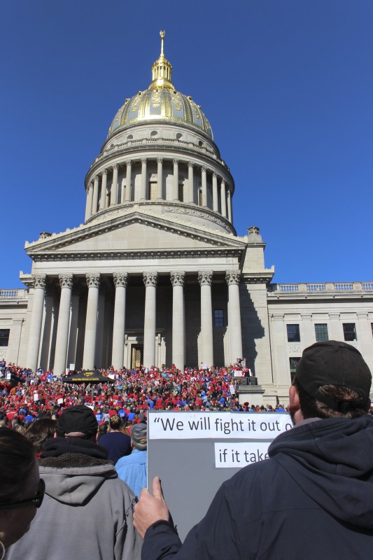 ["On February 22, 2018, thousands of West Virginia public school teachers and school service employees walked out of their classrooms in what would become a nine-day statewide strike. Teachers demands included a 5% raise and affordable healthcare coverage through the West Virginia Public Employees Insurance Agency or PEIA. These photos are part of a series of photos, videos, and interviews documenting the labor lore and expressive culture of the 2018 and 2019 West Virginia Teachers Strike.For more information on the 2018 and 2019 West Virginia Teachers Strike visit e-WV: https://www.wvencyclopedia.org/articles/2454"]%