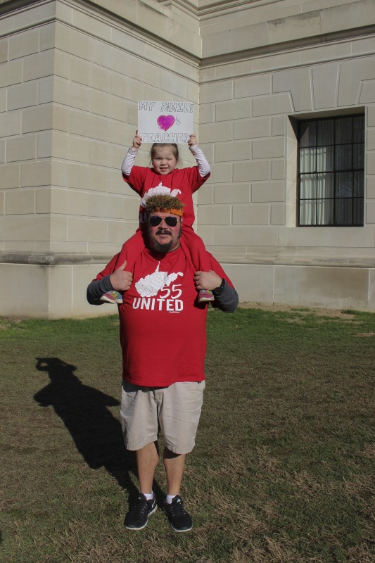 ["On February 22, 2018, thousands of West Virginia public school teachers and school service employees walked out of their classrooms in what would become a nine-day statewide strike. Teachers demands included a 5% raise and affordable healthcare coverage through the West Virginia Public Employees Insurance Agency or PEIA. These photos are part of a series of photos, videos, and interviews documenting the labor lore and expressive culture of the 2018 and 2019 West Virginia Teachers Strike.For more information on the 2018 and 2019 West Virginia Teachers Strike visit e-WV: https://www.wvencyclopedia.org/articles/2454"]%