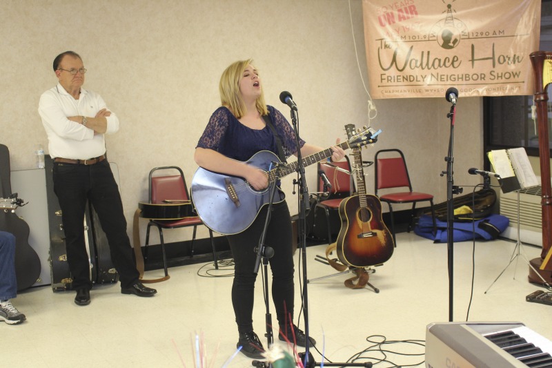 ["The Wallace Horn Friendly Neighbors Show is a live radio program, recorded in Logan County, and airing for over 50 years on WVOW, The Voice of the Coalfields. Wallace Horn founded the show and passed the creative directorship on to Elaine Purkey. This taping of the Friendly Neighbors Show, on November 18, 2017, was recorded at the Chapmanville Towers in Chapmanville, WV. Other taping locations include the Hot Cup coffee shop in Logan. Shows are taped twice a month."]%