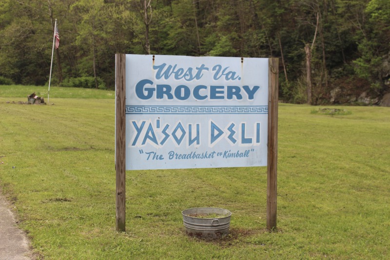 Yasou Restaurant is a Greek restaurant and grocery in Kimball in McDowell County. The restaurant has been owned and operated since 2003 by Markella Gianato whose maternal grandfather John Genadopoulus and father Adamantios Tommy Balasis opened The West Virginia Grocery in the same location in 1947. Genadopolous bought the building from A.P. Wood, whose name still remains on the storefront. The Grocery shut down in 2001 after the July flood all but destroyed the building.Today the restaurant serves as a hub in the Kimball community. Menu offerings include gyros, Greek-style spaghetti and meatballs, spanakopita, Greek salad, pastitsio (a Greek pasta with meat and bchamel), dolmades (stuffed grape leaves), and saganaki (pan-seared Greek cheese).State folklorist Emily Hilliard interviewed Gianato about her family history, foodways, and the business on April 27, 2016, but the interview was lost when Folklife Program equipment was stolen. Gianatos Our History statement on the Yasou website:On February 7, 1947, the Greek-American families of John Genadopoulos and Adamantios Tommy Balasis and Mary Balasis purchased the A.P. Wood Grocery.  Though the store was renamed the West Virginia Grocery, the name A.P. Wood remains etched in beautiful stained glass over the door at present day YaSou. From that time until the devasting flood of July 2001, the family kept the grocery in operation.  Ten months later, a second major flood hit the town within days of the business being reopened.  Despite this major setback, we were determined to move forward and reopen the business. Having my own restaurant was a lifelong dream, and on February 7, 2003, with the help of my mother Mary Balasis, my brothers John and Mathew, my husband Jimmy Joe, my son Adam, my mother-in-law Mary Verduce Gianato and the Grace of God, that dream became a reality with the opening of YaSou Restaurant.   I am immensely proud of the success that I have achieved.  I offer home-cooked meals, daily specials, and Greek cuisine along with many sandwich choices.  Most of the recipes I have used have been handed down to me from my mother and grandmother.  My love for the restaurant business came from my first job at the Virginian Restaurant in Pearisburg, Virginia, working under the guiding hands of, in my opinion, two of the greatest chefs, uncles and mentors, Mike and George Genadopoulos.  It was my days at the Virginian that made me realize I would someday like to become a great chef.  I strive for this every day. This has allowed me to meet many wonderful people who have stopped in along the way, as well as many local regulars who come in and make my day complete.  We hope to serve you for many years to come. Everyone that comes here, even for one time, becomes a part of the labyrinth of my life and will always be part of the memories here.  I want my guests to feel at home and comfortable when that are here.  If you have any concerns or requests, please feel free to ask.                                                             ---MarkellaRead more on the Yasou website: https://yasourestaurant-restaurant.business.site/