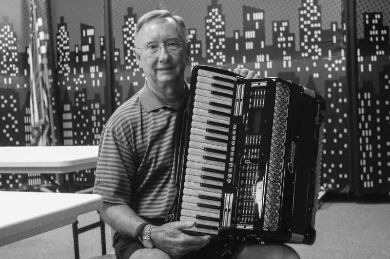 Thomas W. Zielinsky is a member of Weirton, West Virginias Polish community. He is a member of Sacred Heart of Mary Church in Weirton, WV, where he plays accordion at their annual Polish Festival and biannual Polka Mass. Photo made at the Mary H. Weir public library in Weirton.